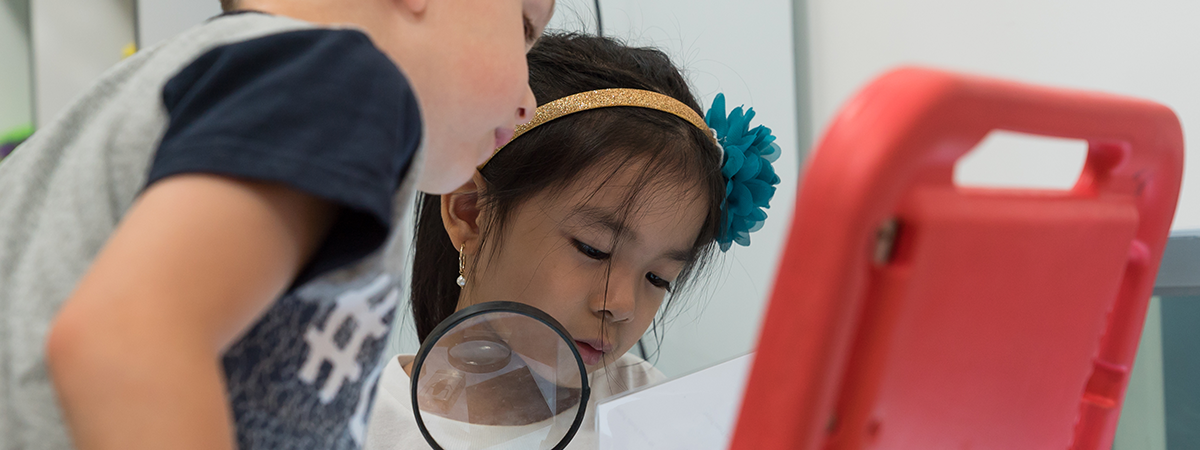 Children using ipad in a kindergarten session.